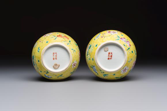 Rob Michiels AuctionsA pair of Chinese famille rose yellow-ground water pots with floral design and applied chilong and bats, Qianlong mark, 19/20th C.