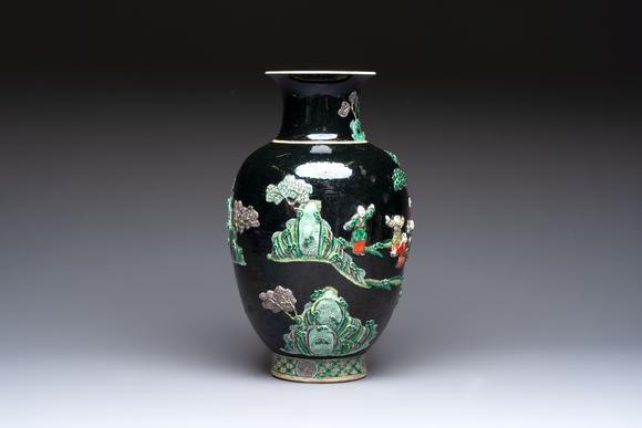 Rob Michiels AuctionsAn unusual Chinese famille noire vase with relief design, Kangxi mark, 19th C.