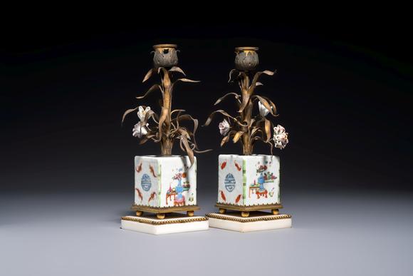 Rob Michiels AuctionsA pair of gilt silver and metal candlesticks with Chinese porcelain, European porcelain flowers, and marble bases, marked Boin-Taburet, late 19th C.