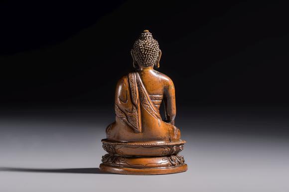 Rob Michiels AuctionsThree Tibetan bronze ritual bells and a bronze Buddha, 19th C.