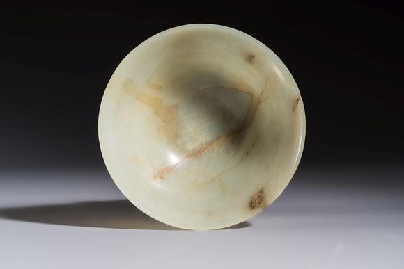 Rob Michiels AuctionsA Tibetan ritual jade bowl with a red coral-mounted silver cover and a stand, 19th C.
