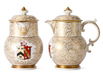 Lot 17 A PAIR OF CHAMBERLAIN'S WORCESTER ARMORIAL JUGS AND COVERS