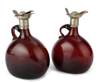 Lot 67 A PAIR OF BROWN GLASS DECANTERS