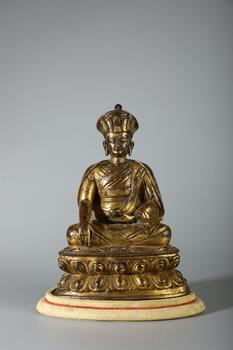 A Gilt Bronze Seated Lama Buddha Statue on Double Lotus Base, China, 18th CE