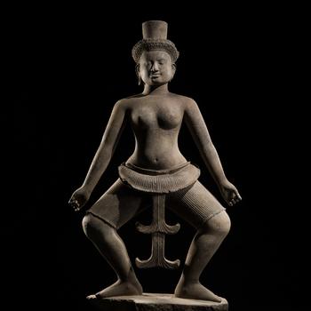 A MONUMENTAL (183 CM) SANDSTONE FIGURE OF A DANCING UMA, ANGKOR PERIOD, KOH KER STYLE