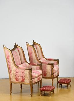 A pair of Louis XVI style bergère armchairs…