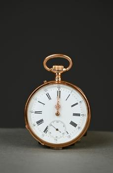 Gold pocket watch with white dial…