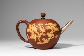 Qing Dynasty, Ca. 18th century AD. >
The teapot of globular form is finely potted in reddish Yixi