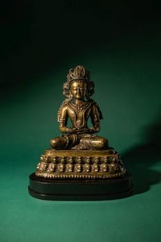 Ca. 14th century AD. >
A finely cast copper alloy figure depicting Kunzang Akor, seated in serene
