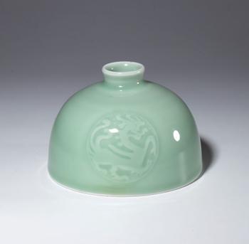 A small celadon-glazed porcelain water pot. China, Republic period (1912-1949).