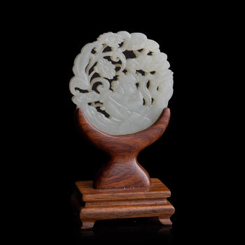 十九世紀早 白玉鏤雕童子佩（附木座）  A Chinese reticulated white jade 'boy' plaque