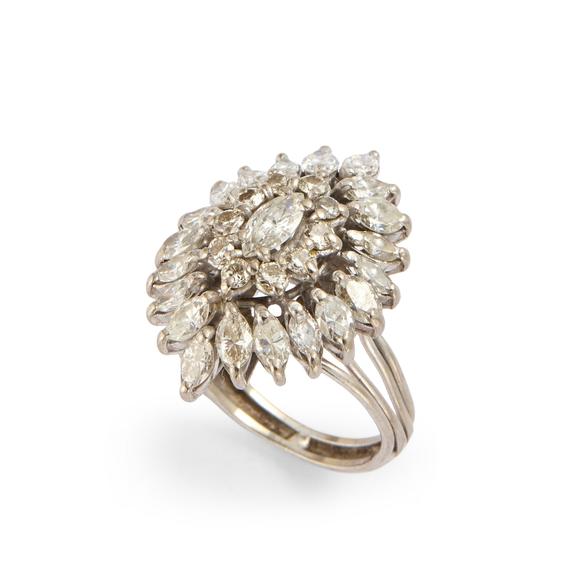 RoseberysA diamond cluster ring, of openwork elliptical form, set with a central marquise-cut diamond within brilliant-cut diamond surround, to outer marquise-