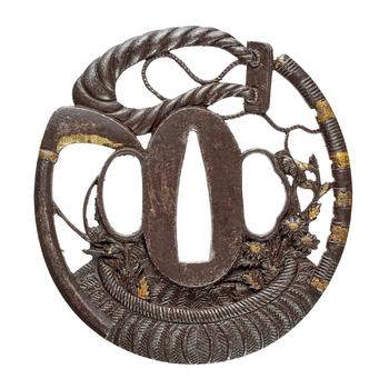 An iron tsuba. 19th century