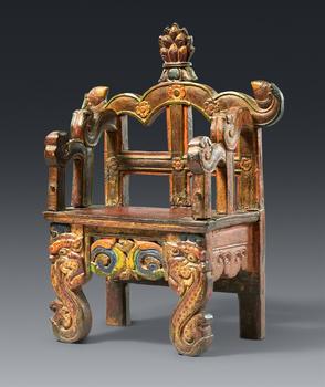A small Tibetan wooden painted throne for a buddha figure. 15/16th century