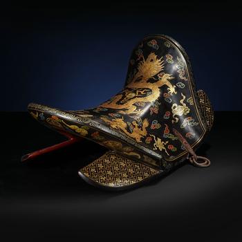 Qing Dynasty Lacquered Saddle with Auspicious Cloud-Dragon Motif