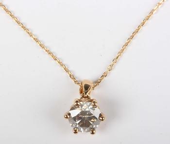 An 18ct gold and diamond single stone pendant, claw set with a circu
