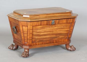 A George IV mahogany wine cooler of panelled sarcophagus form, the s