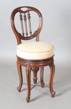 A Victorian rosewood framed revolving music chair, on cabriole legs,
