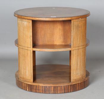 An Art Deco walnut revolving book table by Heal & Son Ltd, the quart
