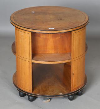 An Art Deco walnut revolving book table by Heal & Son Ltd, the quart