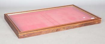 A 20th century glazed shallow display case with hinged front, height