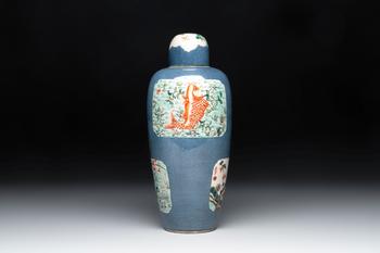 A Chinese famille verte powder-blue-ground 'Fish and Bird' vase and cover, 19th C.