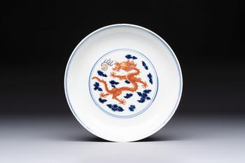 A Chinese blue and white iron-red-decorated 'Dragon' plate, Jing Jin Tang 精進堂 mark, 19th C.