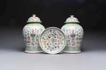 A pair of Chinese famille rose 'Antiquities' covered vases and a dish, 19th C.