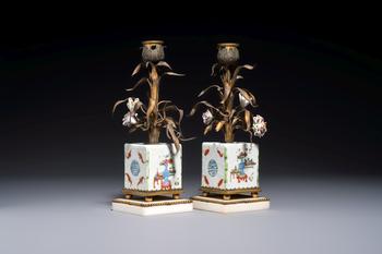 A pair of gilt silver and metal candlesticks with Chinese porcelain, European porcelain flowers, and marble bases, marked Boin-Taburet, late 19th C.