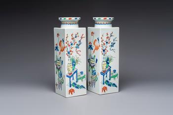 A pair of Chinese famille verte 'Antiquities' square vases, 19th C.