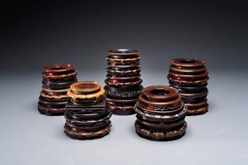 A collection of 20 Chinese wooden stands, 19/20th C.