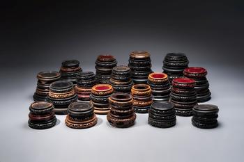 A collection of 80 Chinese wooden stands, 19/20th C.