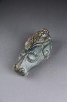 古玉獸面仙人像