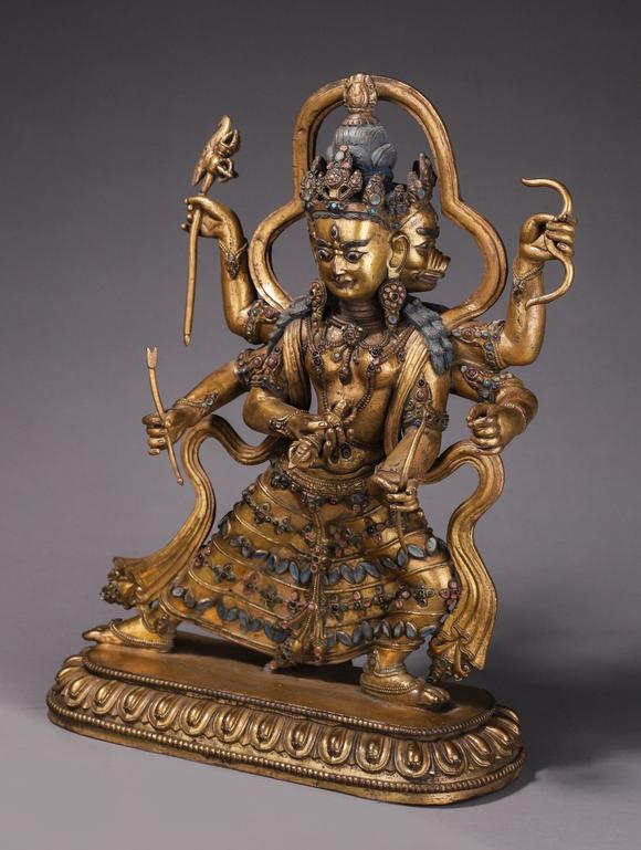 铜鎏金三头六臂佛像