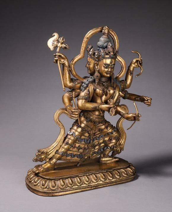 铜鎏金三头六臂佛像